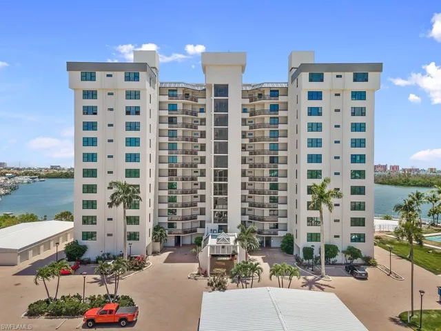 View of property with a water view