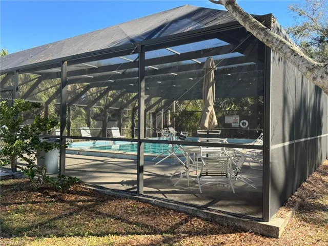 View of pool with a lanai