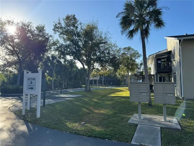 View of home's community with mail boxes
