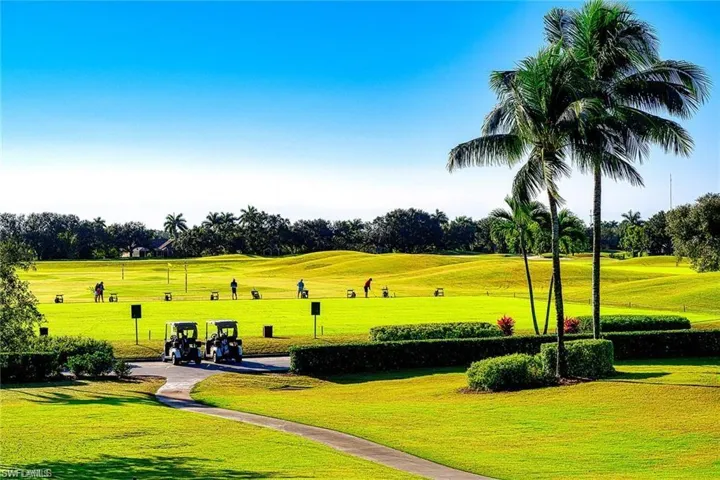 View of property's community with a yard