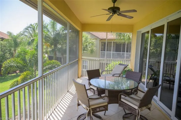 Sunroom / solarium featuring plenty of natural light and ceiling fan
