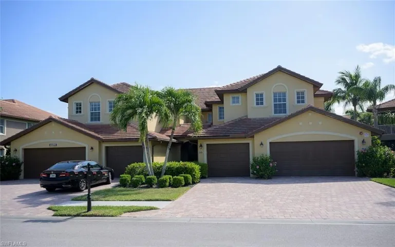 Mediterranean / spanish-style house featuring a garage