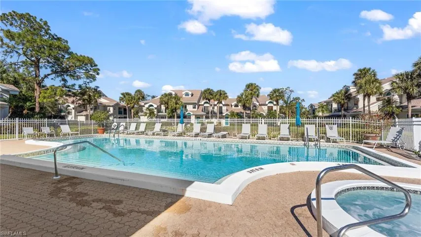View of pool featuring a patio area and a hot tub
