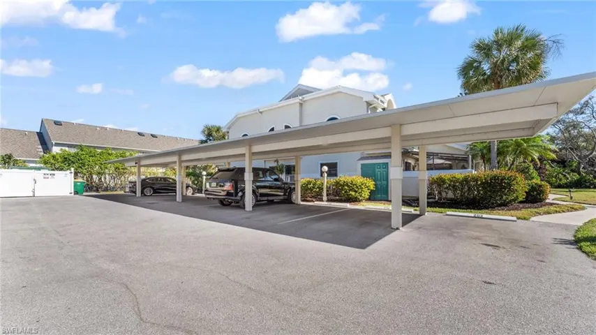 View of vehicle parking featuring a carport