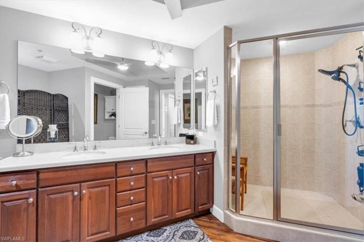 Large walk in shower and dual vanity.