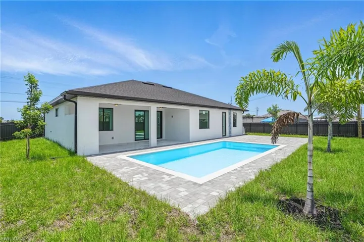 Back of property featuring a patio area and stucco siding
