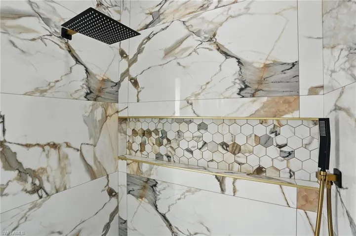 Bathroom view of a marble finish shower
