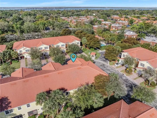 Aerial perspective of suburban area featuring a tree filled landscape