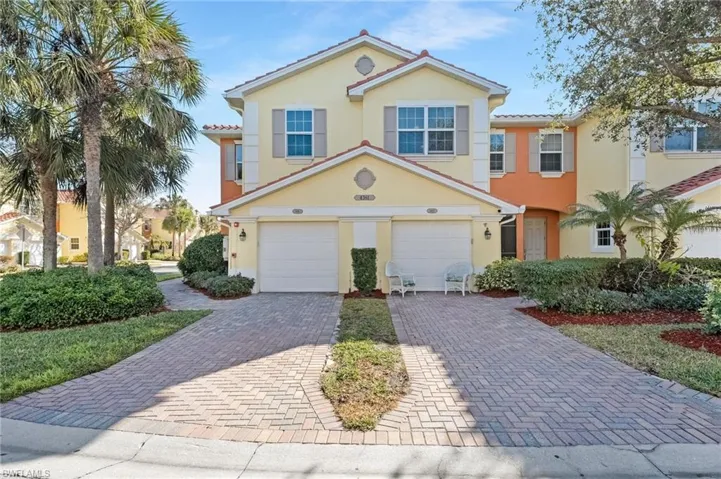 Mediterranean / spanish-style home featuring an attached garage, decorative driveway, and stucco siding