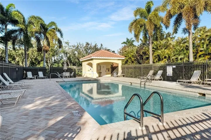 Community pool with a patio area