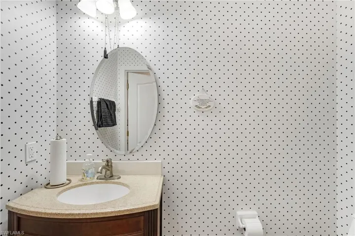 Half bath featuring vanity and toilet