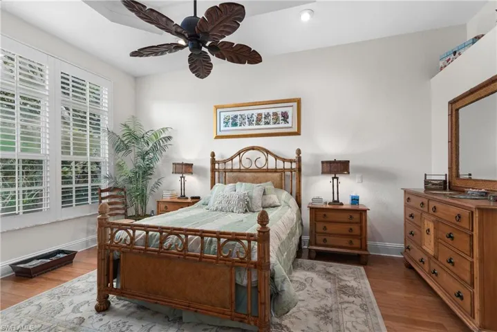 Bedroom with ceiling fan and wood-type flooring