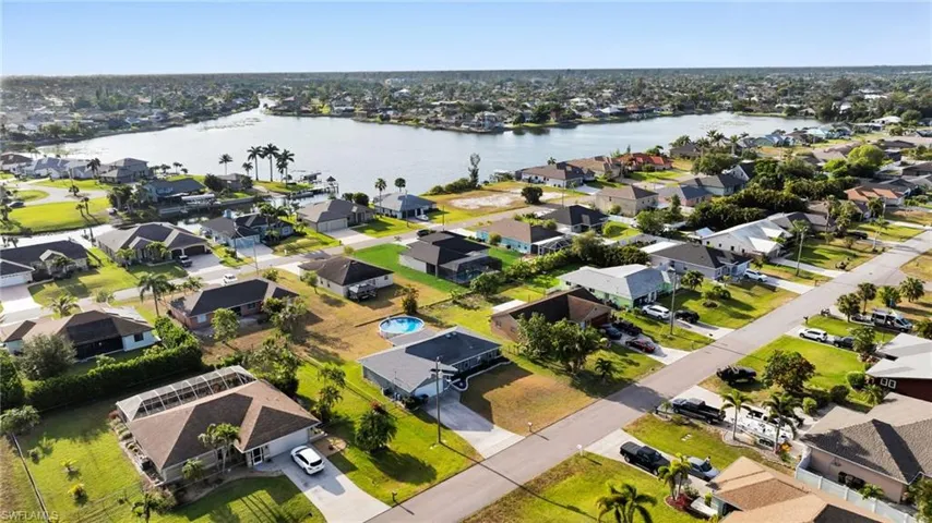 Drone / aerial view featuring a water view and a residential view