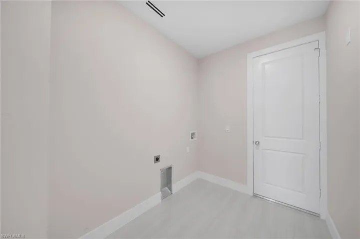 Laundry room featuring hookup for an electric dryer, visible vents, baseboards, hookup for a washing machine, and laundry area