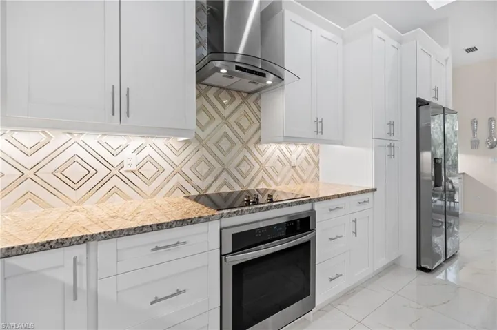 Kitchen featuring glass top stove and wall oven!