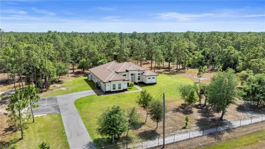 Aerial view featuring the driveway.