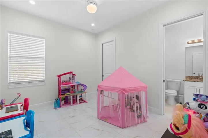 4th bedroom used as playroom, it features recessed lighting and it has its own bathroom!