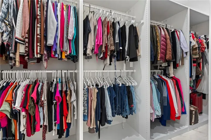 Custom-made walk-in closet for her! This picture doesn't make it justice. It was enlarged for your enjoyment!