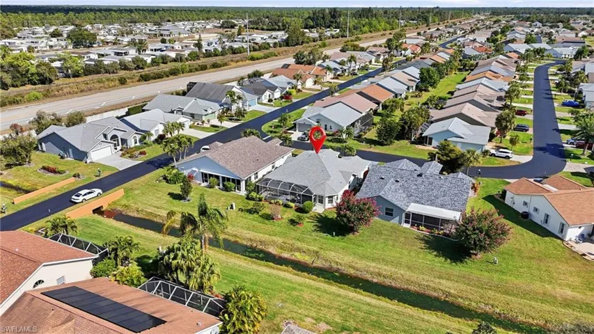 View of property location with nearby suburban area