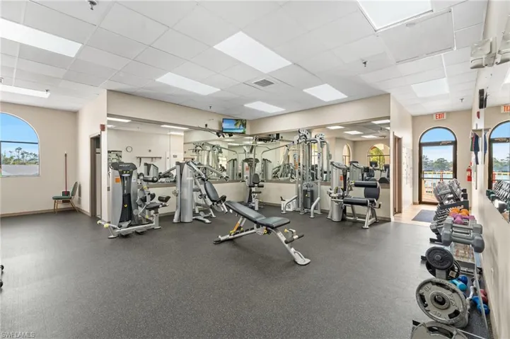Workout area with a paneled ceiling