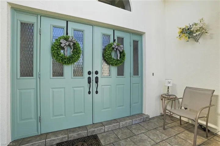 Property entrance with stucco siding
