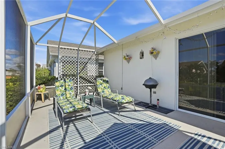 Sunroom / solarium with a patio