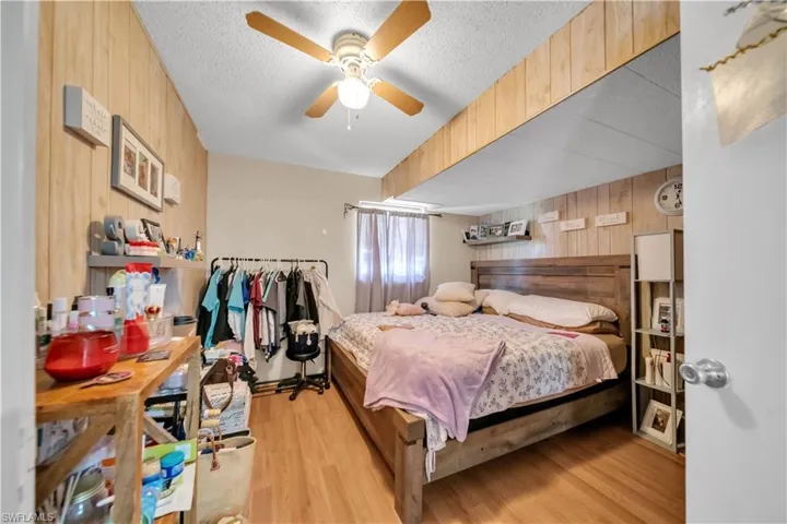 Room featuring light gray floor tiles and a ceiling fan with integrated lighting