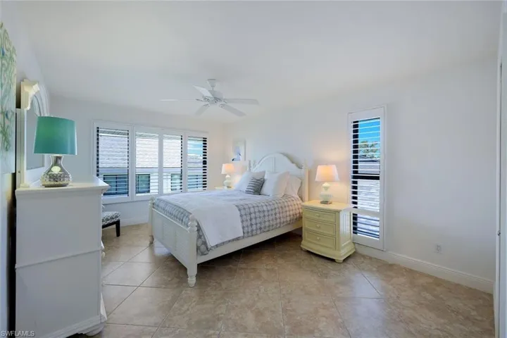 Lovely Large Second Guest Bedroom with Walk In Closet- Shown with a Queen Bed