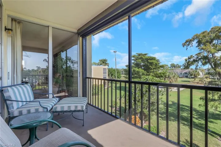 Sunroom with a wall of windows