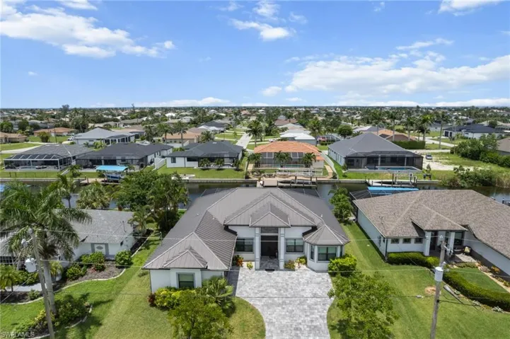Aerial view of residential area featuring a large body of water