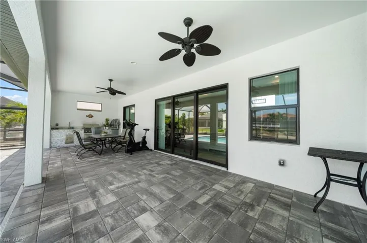 View of patio featuring a ceiling fan and outdoor dining space