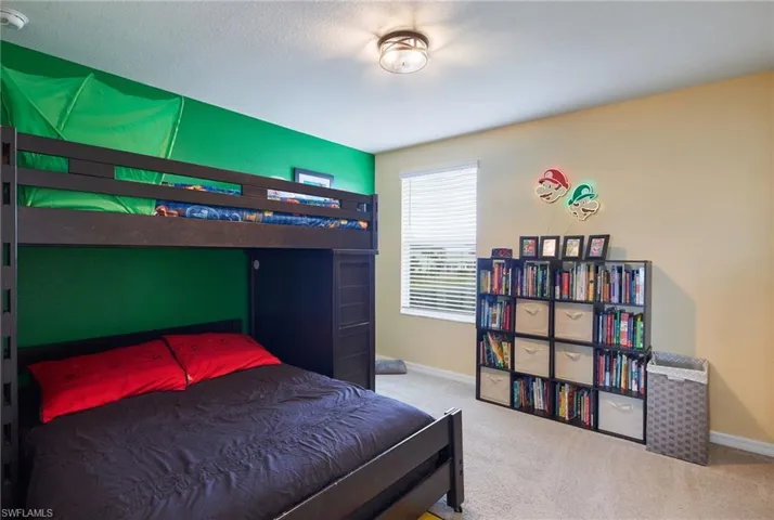 Carpeted bedroom featuring a textured ceiling