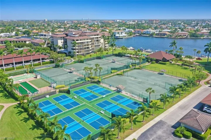 Birds eye view of property with a water view