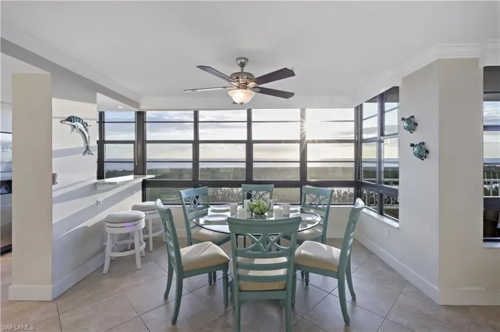 Sunroom featuring ceiling fan