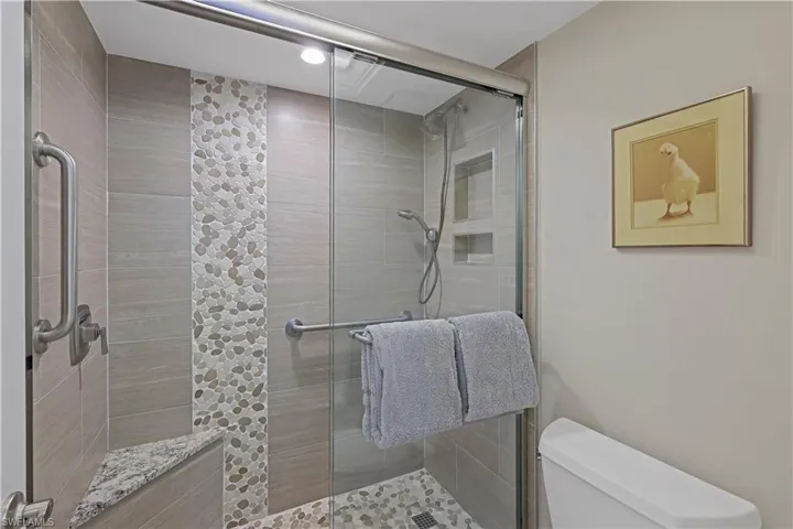 Bathroom with walk in shower and toilet
