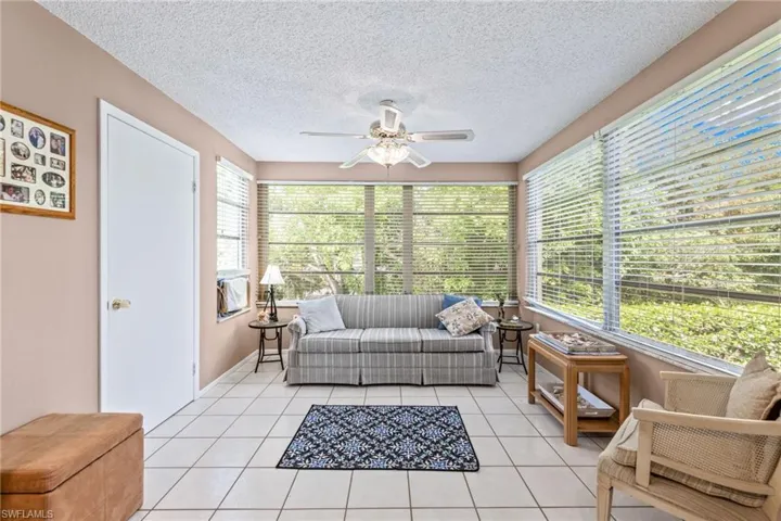 Sunroom featuring ceiling fan