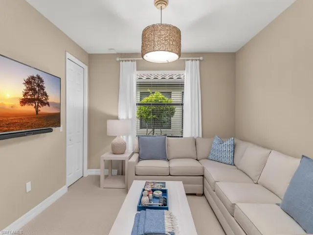 Living room featuring light colored carpet