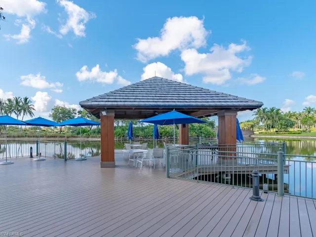 Wooden terrace with a water view and a gazebo