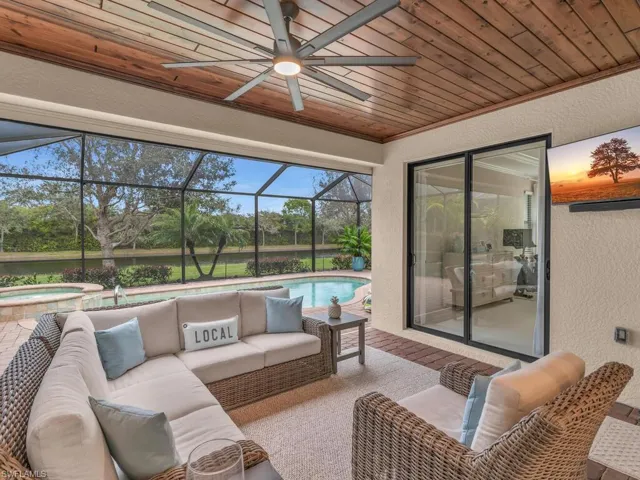Sunroom / solarium with ceiling fan and wooden ceiling