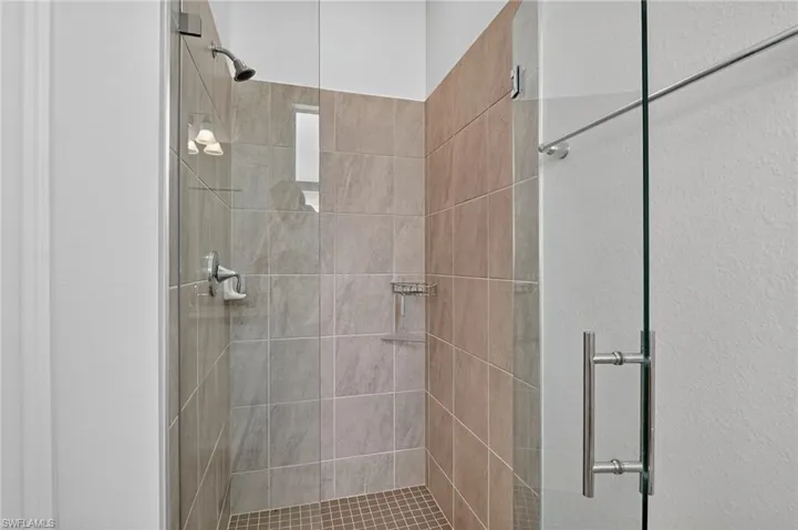 Full bathroom with a shower stall