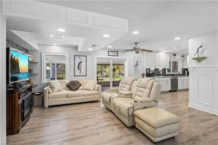Perfect for entertaining, the living area connects effortlessly to the kitchen and outdoor pool deck.