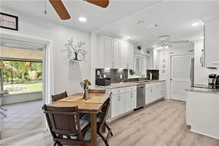 The open dining area flows effortlessly from the kitchen, creating a seamless space for meals and entertaining.