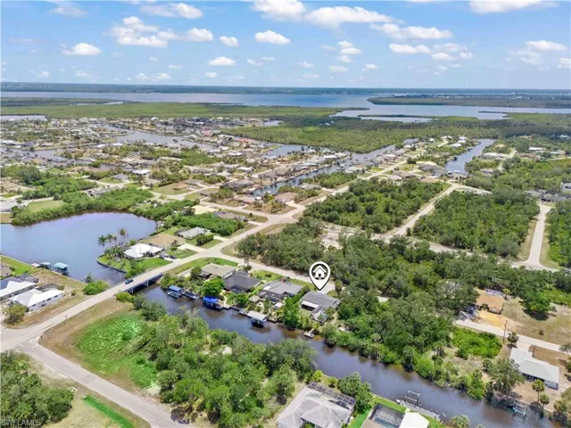 An aerial perspective reveals your private slice of paradise—nestled along serene waterways that lead straight to the Gulf of Mexico.