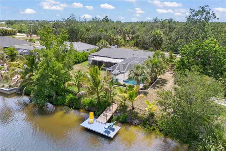 Step into this beautifully updated 3-bed, 2-bath Craftsman home with a private pool oasis and kayak launch leading to the Gulf.