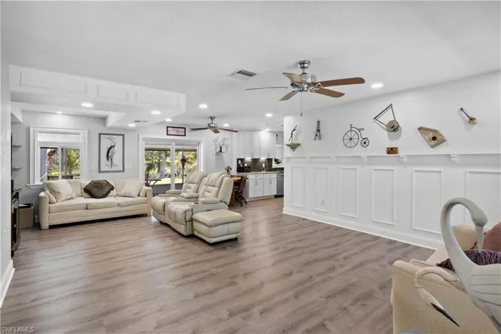 The spacious living area flows seamlessly into the beautifully updated kitchen—perfect for entertaining or quiet nights in.