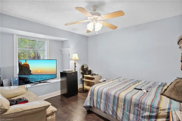 A spacious guest bedroom designed to offer comfort and privacy for visitors.