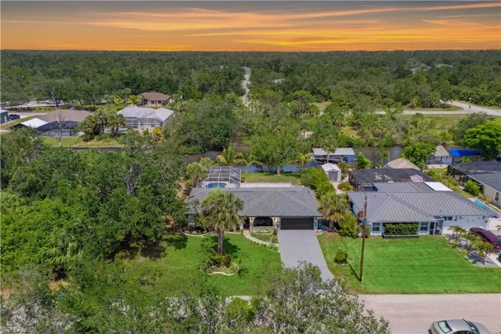 Your dream Florida lifestyle starts here—lush landscaping, screened-in pool, and boating from your own backyard dock.