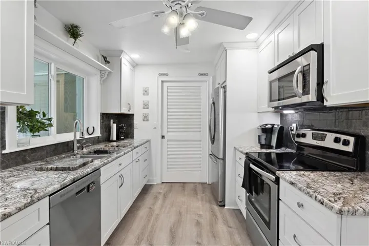 Enjoy cooking in a bright, airy kitchen equipped with stainless steel appliances and generous counter space.