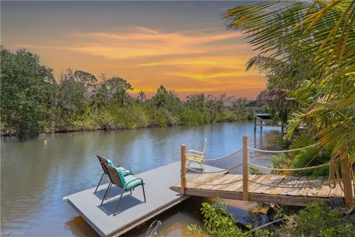 Welcome to your Gulf-access Craftsman retreat—where timeless style meets tropical tranquility in the heart of Port Charlotte.