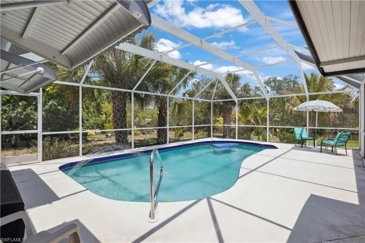 Craftsman charm meets coastal living with Gulf access and a stunning pool!